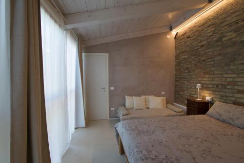 A bed or beds in a room at La Casa di Tara B&B Armonia e Natura