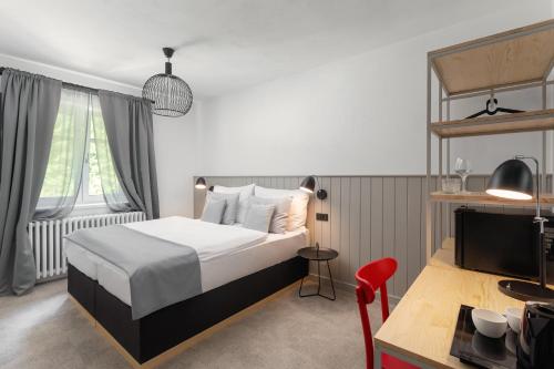 Postel nebo postele na pokoji v ubytování Hotel Orlík