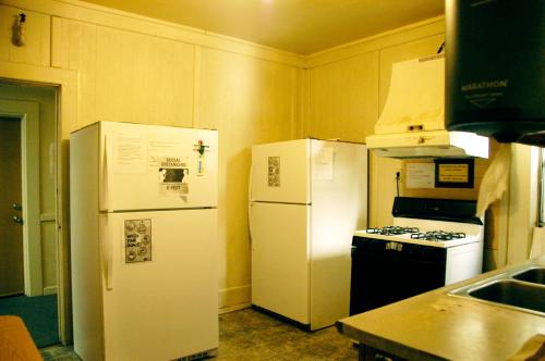 a kitchen with two white refrigerators and a stove at Little Tokyo Hotel in Los Angeles