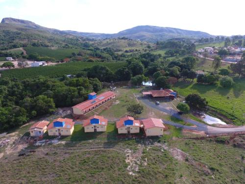an aerial view of a house on a hill at Chalés Cantinho da Roça in Capitólio