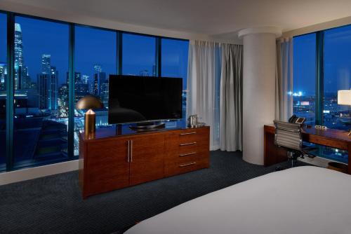 
a bedroom with a large bed and a television at InterContinental San Francisco, an IHG Hotel in San Francisco
