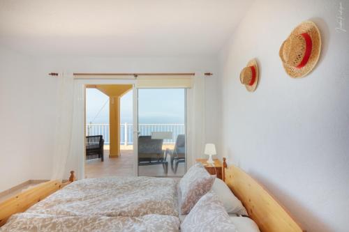 Postel nebo postele na pokoji v ubytování Villa Puerto Naos