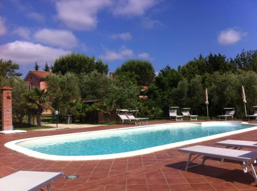 The swimming pool at or close to Fattoria di Collemezzano
