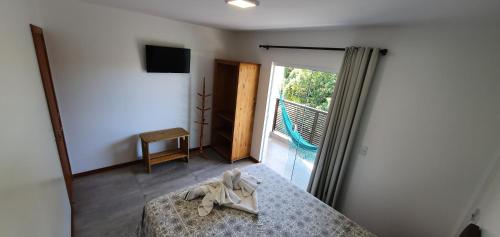 Ένα ή περισσότερα κρεβάτια σε δωμάτιο στο Morada da Figueira