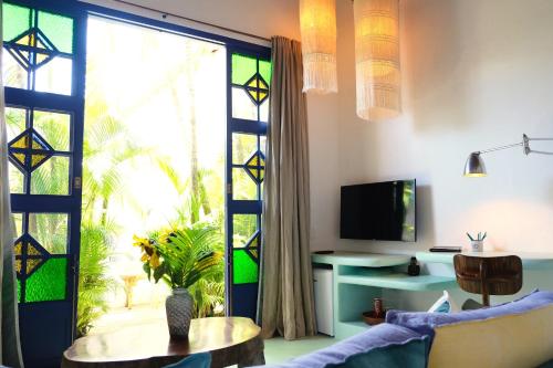 Телевизор и/или развлекательный центр в UXUA Casa Hotel & Spa