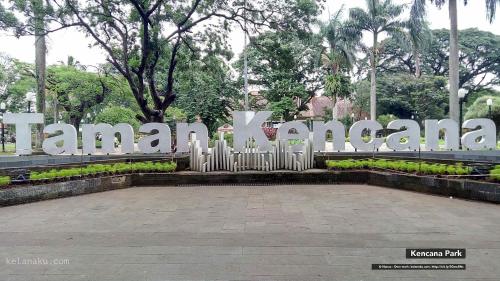 a large sign in front of a park at Citrus-House com Hotel in Bogor