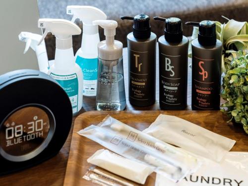 a group of bottles of hair products on a table at The Celecton Kurume in Kurume