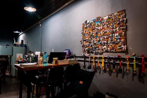 a room with a table with hockeyoons on a wall at MILU Backpacker Hostel in Puli