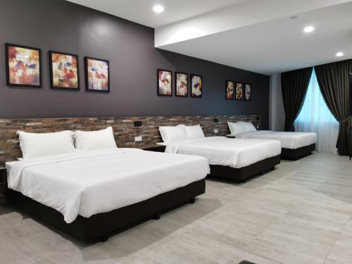 Postel nebo postele na pokoji v ubytování L Hotel