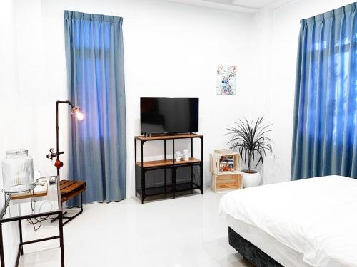 Ένα ή περισσότερα κρεβάτια σε δωμάτιο στο Rightday Inn