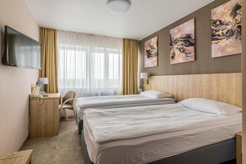 Posteľ alebo postele v izbe v ubytovaní AMAKS Omsk Hotel