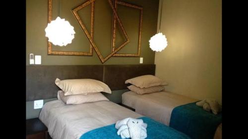 Ένα ή περισσότερα κρεβάτια σε δωμάτιο στο Damascus Bush Lodge