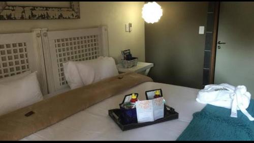 Ένα ή περισσότερα κρεβάτια σε δωμάτιο στο Damascus Bush Lodge