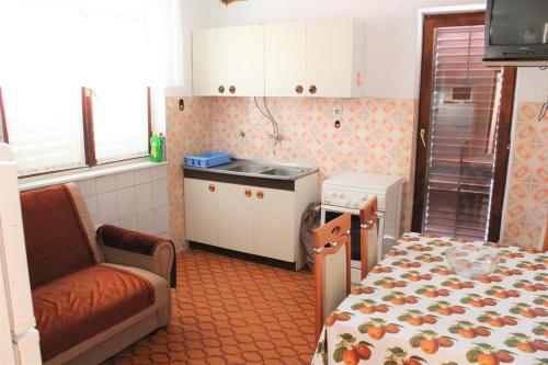 Kuchyň nebo kuchyňský kout v ubytování Apartments Šiša