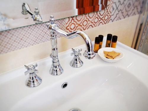 a bathroom sink with a chrome faucet at Agriturismo Casale Cerere in Lacedonia