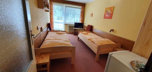 Postel nebo postele na pokoji v ubytování Hotel Poprad