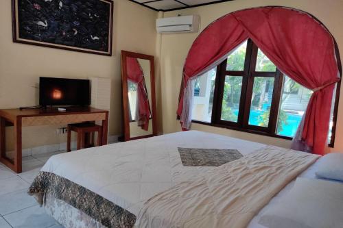 Ένα ή περισσότερα κρεβάτια σε δωμάτιο στο Villa Puri Royan