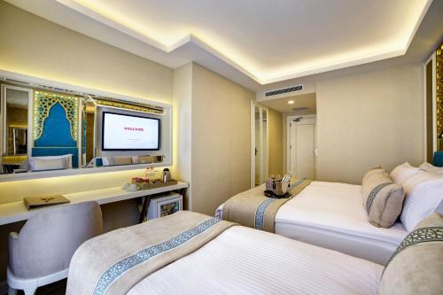 Katil atau katil-katil dalam bilik di Great Fortune Design Hotel & Spa