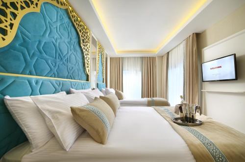 Krevet ili kreveti u jedinici u objektu Great Fortune Design Hotel & Spa