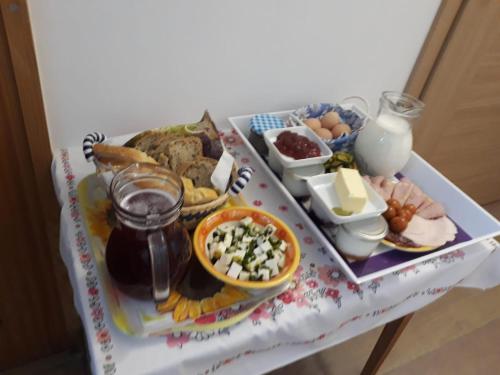a tray of food on a table with cheese and other foods at Eko kmetija Gerbec in Grahovo