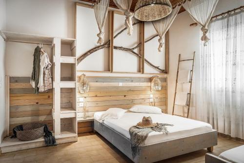 a bedroom with a bunk bed and a ladder at Kanela Studios in Alykes