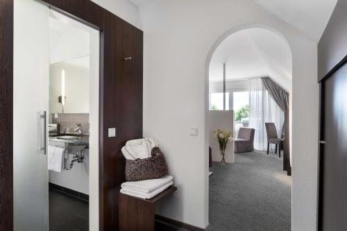 Postel nebo postele na pokoji v ubytování Ganter Hotel & Restaurant Mohren