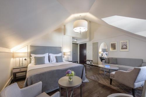 Voodi või voodid majutusasutuse Bastion Heritage Hotel - Relais & Châteaux toas