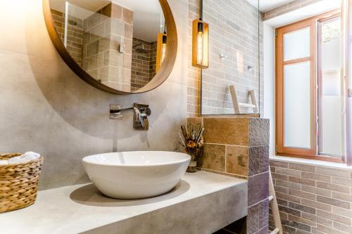 a bathroom with a sink and a mirror at Palazzino d Irene in Rethymno Town