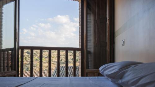 Posteľ alebo postele v izbe v ubytovaní San Cipriano con parking incluido - Apartamentos Aloha Toledo