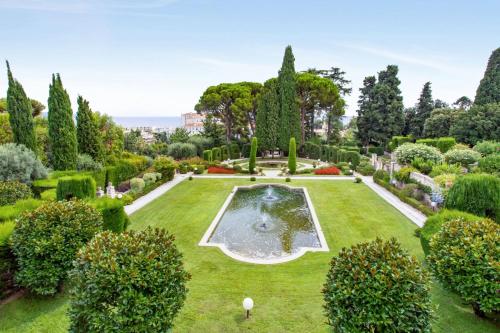 an aerial view of a garden with a fountain at Le Belvédère Niçois Welkeys in Nice