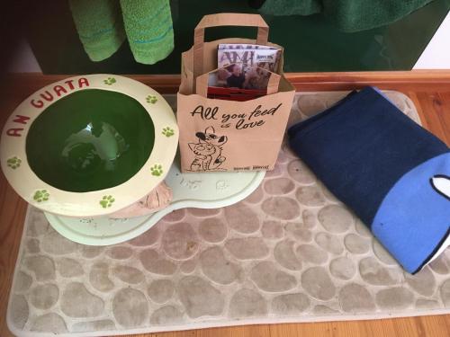 a cup of coffee and a box on a table at Naturforsthaus Eddas Zimmer für Hunde - und naturverbundene Menschen in Preitenegg