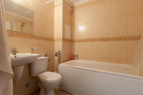 a bathroom with a toilet and a tub and a sink at Etara 2 - Homely 1 Bed Apartment in Sveti Vlas