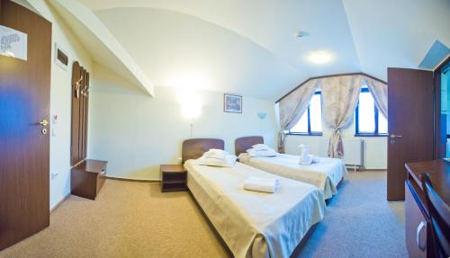 Postel nebo postele na pokoji v ubytování Hotel Piemonte