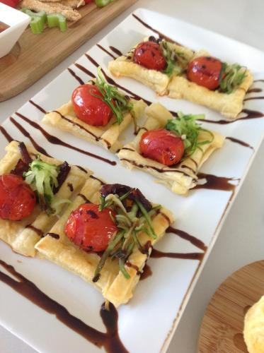 a white plate with four food items on it at Azamare Guest House in Cape Town