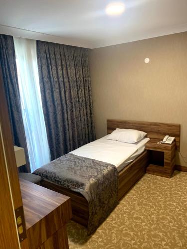 Ένα ή περισσότερα κρεβάτια σε δωμάτιο στο Marbes HOTEL