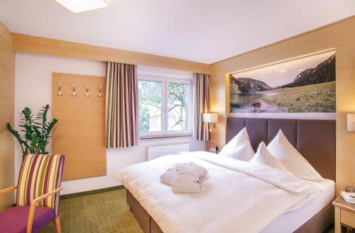 Postel nebo postele na pokoji v ubytování Hotel Sägerhof