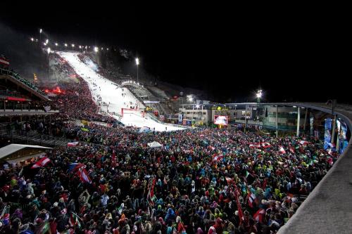 a large crowd of people watching a ski slope at night at Appartement IRIS in Rohrmoos