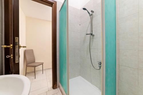 a bathroom with a shower with a toilet and a sink at Casa del Pescatore in Castellammare di Stabia