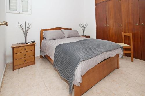เตียงในห้องที่ Férias sem Carro - Apartamento Praia e Piscina