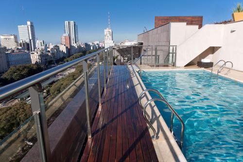 a swimming pool on the roof of a building at NH Buenos Aires 9 de Julio in Buenos Aires