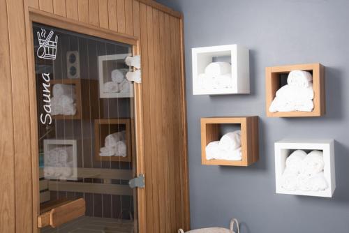 a room with two wooden niches with towels in them at Hotel Les Dunes in La Tranche-sur-Mer