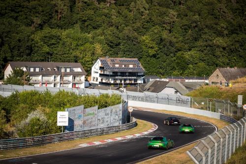
a road filled with lots of cars and trucks at Hotel an der Nordschleife in Adenau
