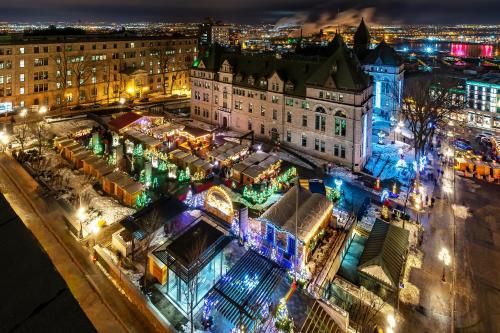 an aerial view of a city at night with christmas lights at Les Lofts St-Pierre - Par Les Lofts Vieux-Québec in Quebec City