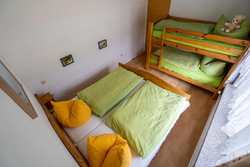 an overhead view of two bunk beds in a room at Pension Glückauf in Kurort Oberwiesenthal