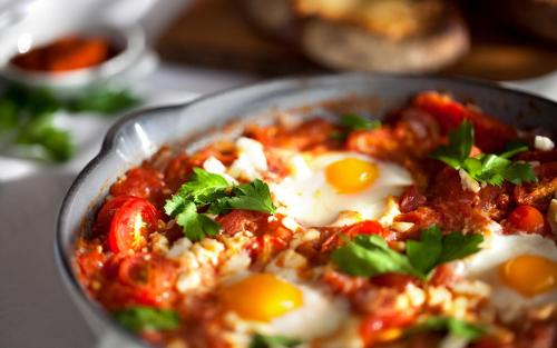 a dish of food with eggs on a table at InterContinental San Francisco by IHG in San Francisco