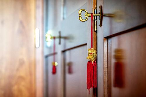 a cross hanging on the door of a church at Hotel Al Poggio Verde in Barghe