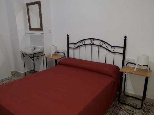 Letto o letti in una camera di Pensión Las Cuatro Naciones