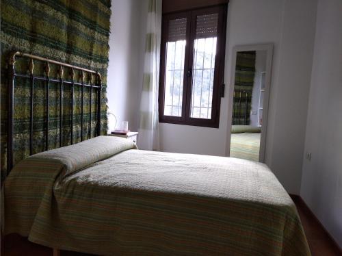 Postel nebo postele na pokoji v ubytování Alojamiento rural con vistas al rio Trevelez