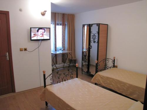 Кровать или кровати в номере Pensiunea Pluto Sulina