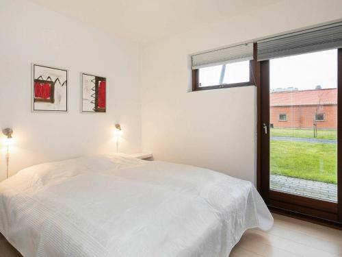 Two-Bedroom Holiday home in Bogense 7 tesisinde bir odada yatak veya yataklar